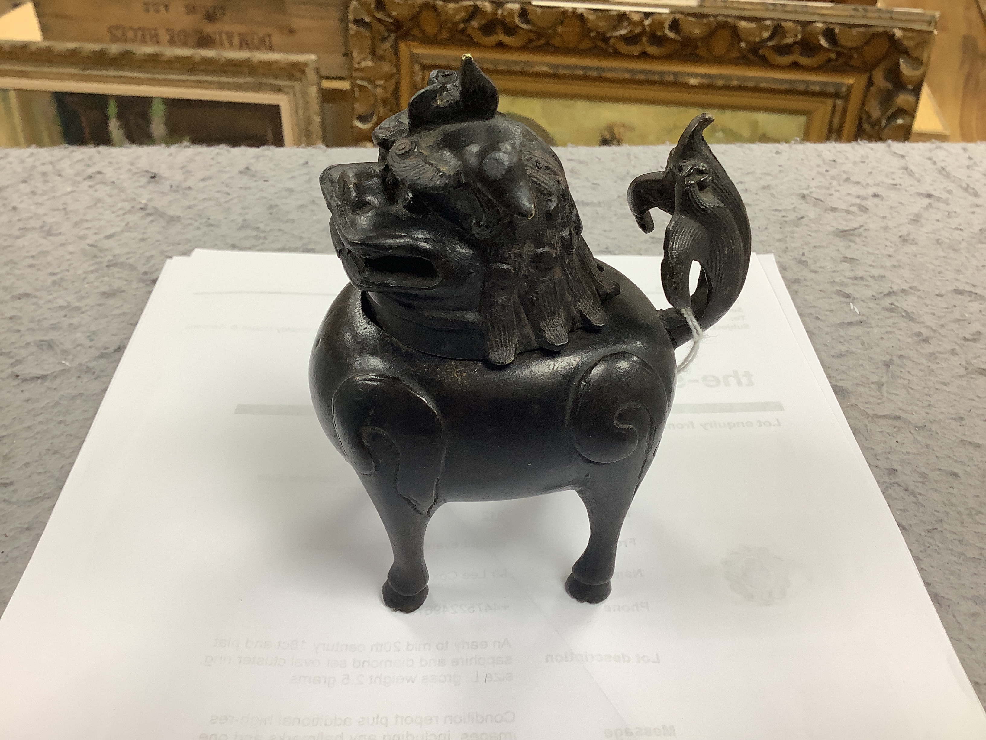 A Chinese bronze mythical beast censer and cover (Luduan), 17th century, the cover with pierced mouth, 9cm in length